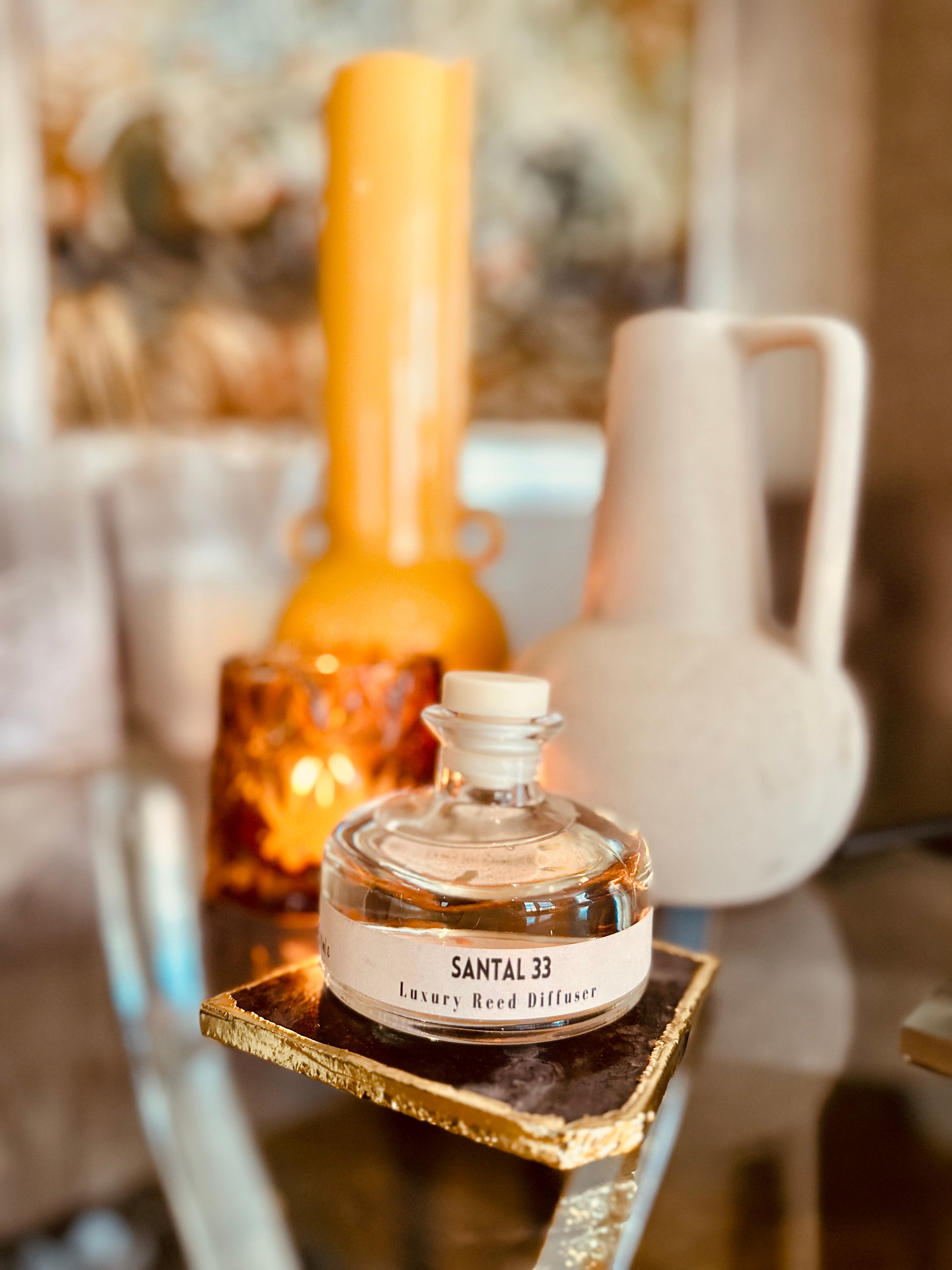 
Elevate your home fragrance game with our Santal Clear Glass Reed Diffuser.

Inspired by the luxurious Santal 33 by Le Labo, our 200ml diffuser adds a touch of sophistication to any space. Enjoy the long-lasting scent of this high-quality dupe in a sleek and modern clear glass design. Comes complete with 5 black fibre reeds.