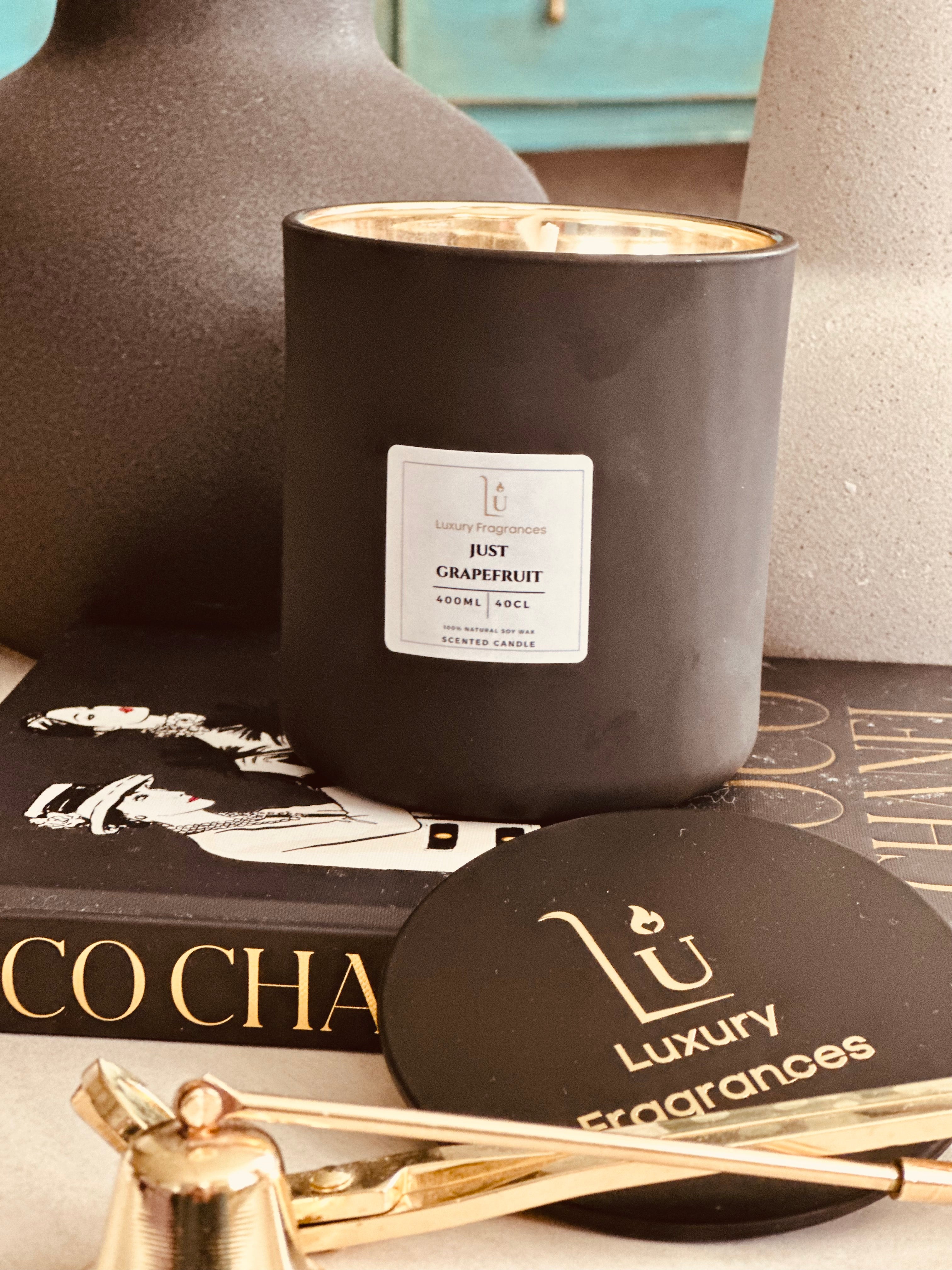 Elevate your home decor with our Matte Black Lux Scented Candle (Vogue). Experience the exquisite luxury of this home fragrance range.

Featuring a matte black design with a mercury gold inlay and black lid, that adds a touch of sophistication to any room. Indulge your senses with its captivating scent and create a welcoming ambiance for any occasion.