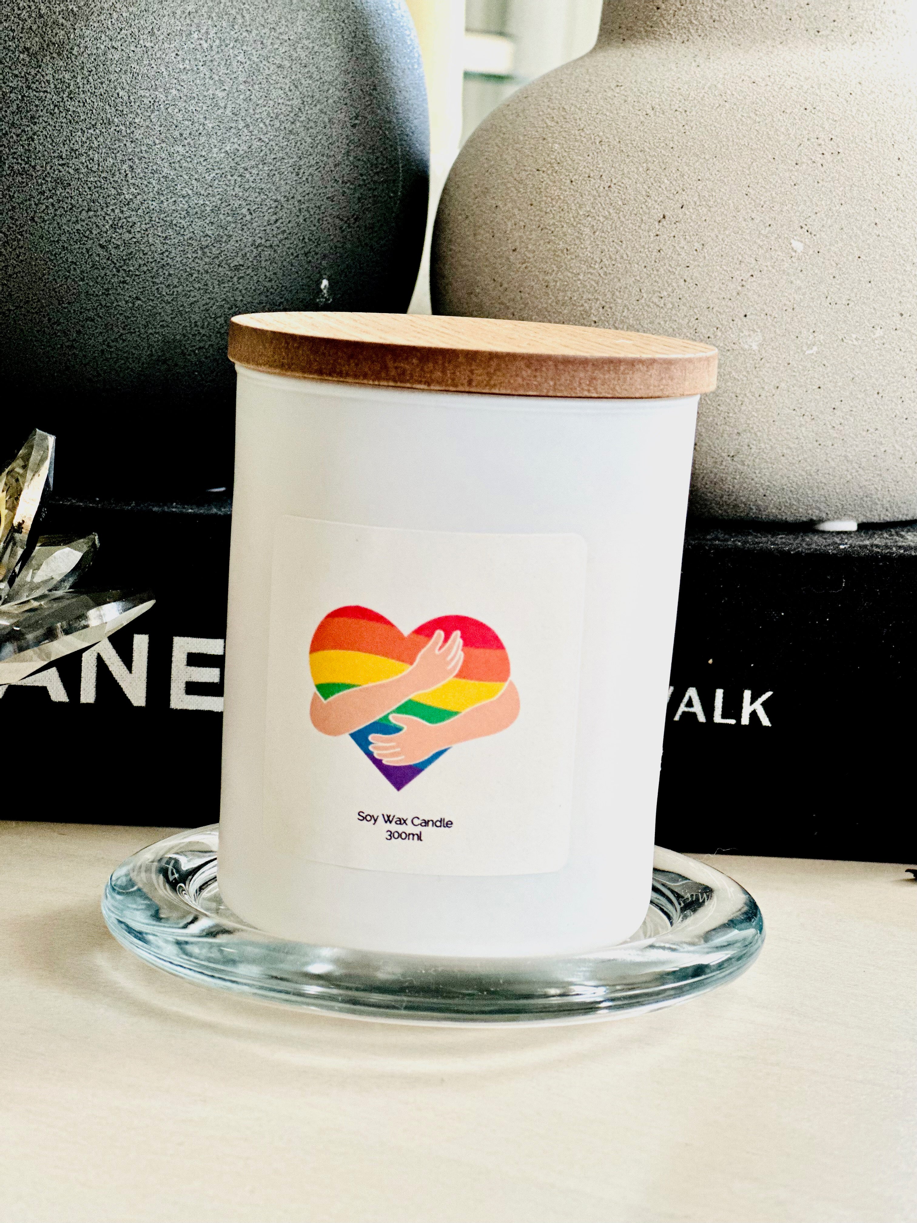 Enhance your space with our Pride Scented Glass Candle, a testament to inclusivity and joy. Embodying the essence of pride, each candle bears a cherished word for all to aspire towards and honor. Join us in spreading love and acceptance through the warm and inviting glow of our scented candle.