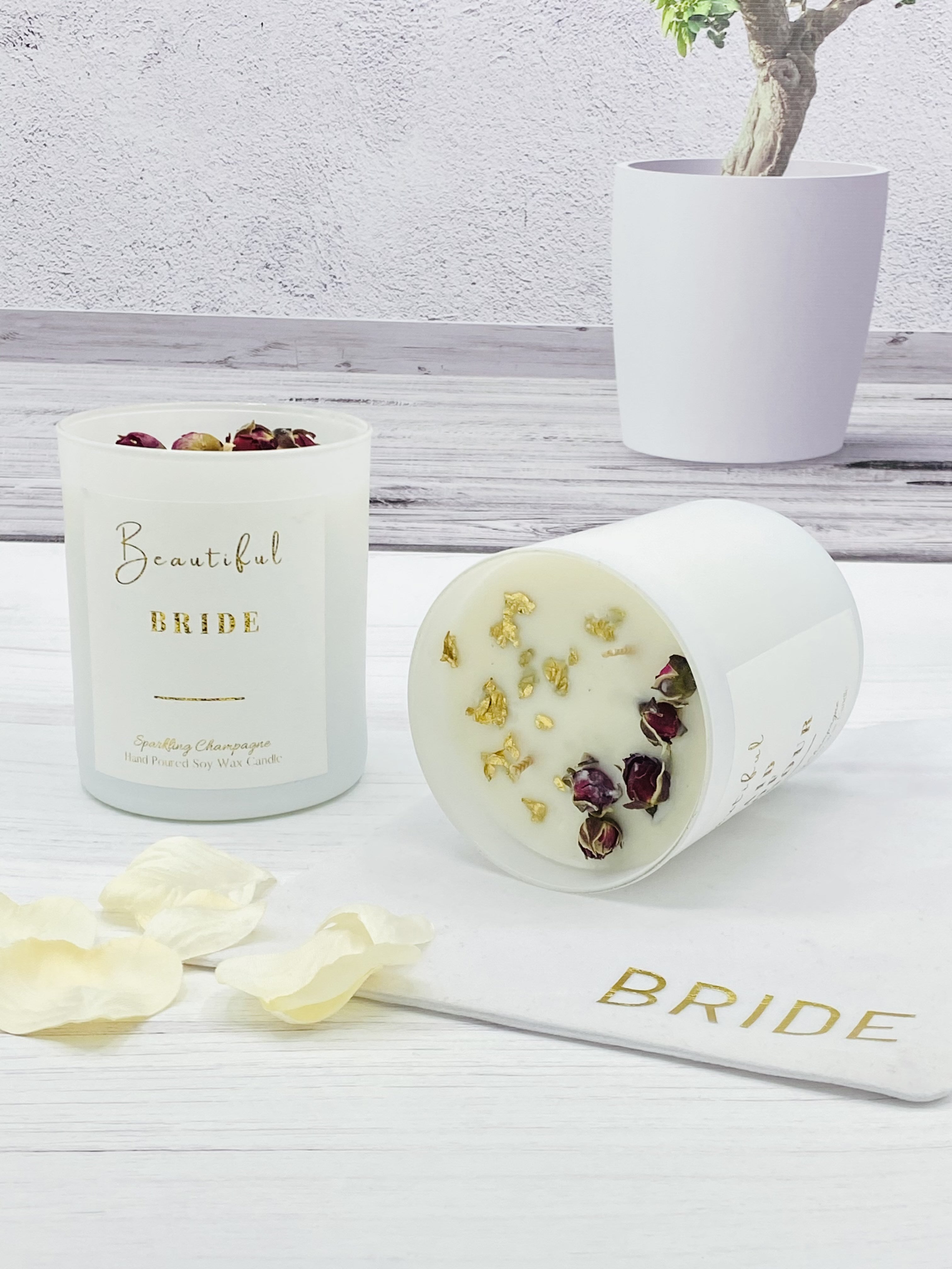 Introducing the Beautiful Bride Luxury Candle in the Wedding Day fragrance. Made with premium ingredients, this candle sets the perfect ambiance for your special day. With a clean, floral scent, it will enhance the atmosphere and create beautiful memories for you and your guests.